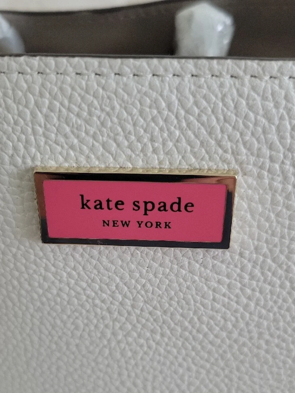 kate spade White Pebbled Leather Satchel with Pink Logo Plaque